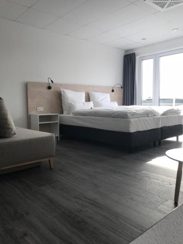 Ένα ή περισσότερα κρεβάτια σε δωμάτιο στο Hotel an der Burgschänke