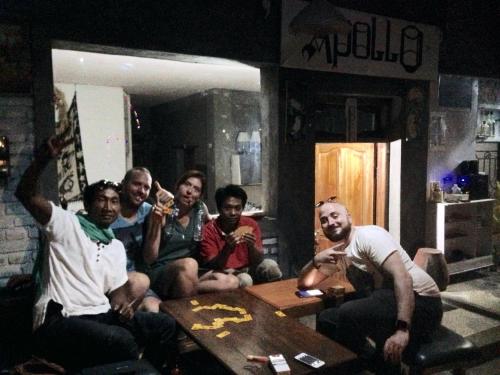 a group of people sitting in a living room at Apollo Hostel in Lovina