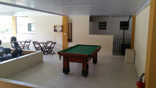 a room with a pool table in a room at Pousada H&D in Angra dos Reis