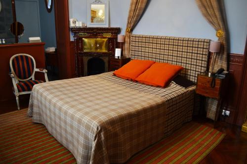 Hotel Windsor Home tesisinde bir odada yatak veya yataklar