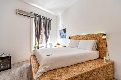Posteľ alebo postele v izbe v ubytovaní SmooRoomS Ostiense