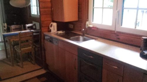 a kitchen with a sink and a counter top at Ferienhaus Nr. 52 im Ferienpark am Twistesee in Bad Arolsen