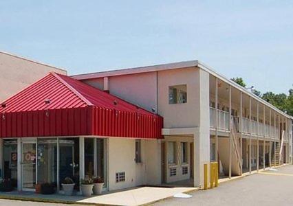 a large building with a red roof at Americas Best Value Inn Richmond VA Midlothian Turnpike in Richmond