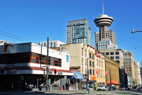 a city street with buildings and a tower at Vancouver Hideaway Guesthouse in Vancouver