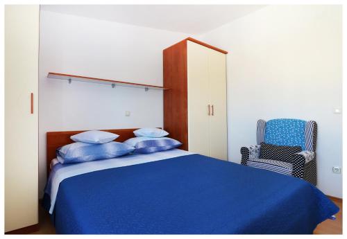 En eller flere senge i et værelse på Apartmani Petra