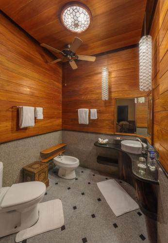 a bathroom with a toilet and a sink at NoaNoa Private Island in Taytay