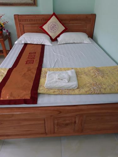 Postel nebo postele na pokoji v ubytování Yen Minh Hotel Thien An