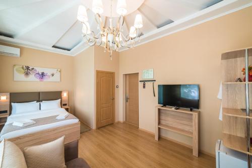 Кровать или кровати в номере Отель Teplo