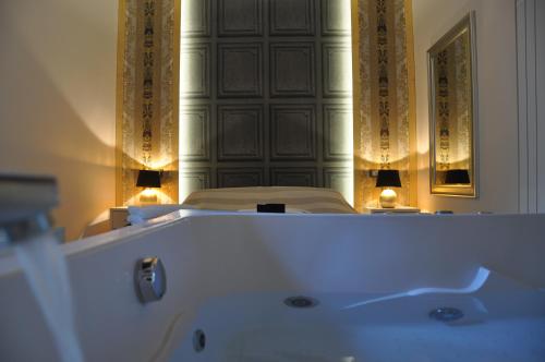 a white bath tub in a room with a mirror at Navona Nice Room in Rome