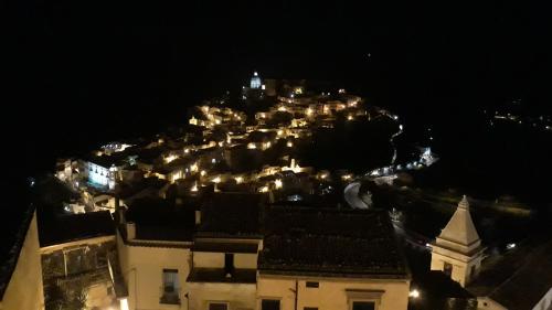 a view of a city at night with lights at Via Pezza 100 in Ragusa