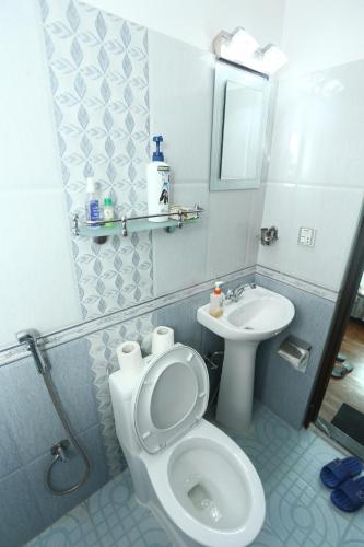 a bathroom with a toilet and a sink at Delights Home in Kathmandu