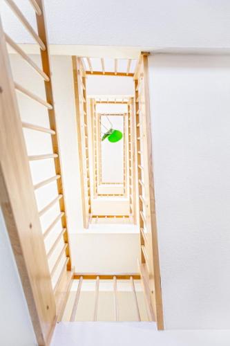 a staircase in a room with a window at Ecoinn in Esslingen