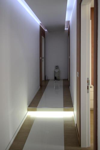 an empty hallway with a light on the ceiling at B&B Dimora Silvestri in Polignano a Mare
