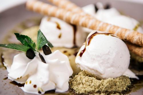 a dessert with ice cream and a waffle at Hotel Gasthof Lamm in Bregenz