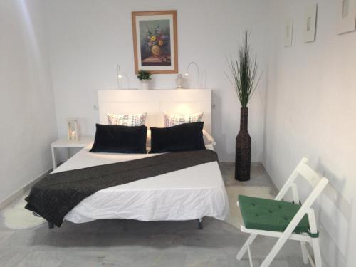 Кровать или кровати в номере Apartamentos vista a tres continentes