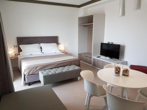 Postel nebo postele na pokoji v ubytování Venus Suites