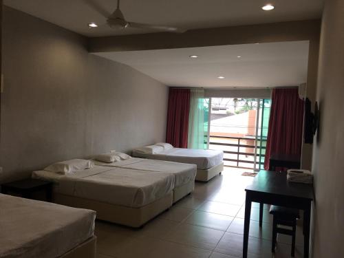 Ένα ή περισσότερα κρεβάτια σε δωμάτιο στο Meng Meng GuestHouse