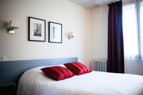 Postel nebo postele na pokoji v ubytování Hôtel Carmin