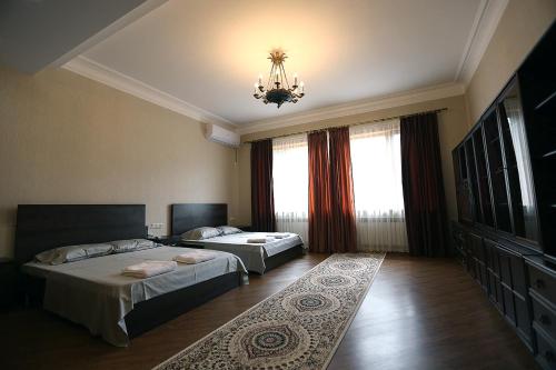 Giường trong phòng chung tại Center Villa Kutaisi