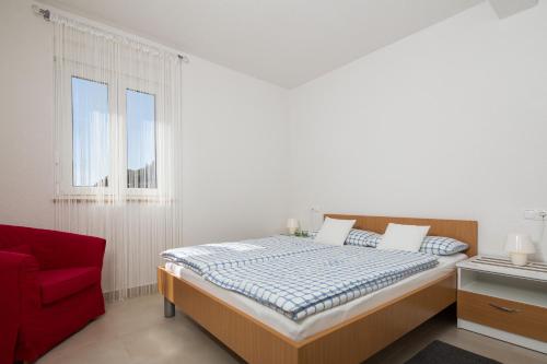 Appartments Villa Daria tesisinde bir odada yatak veya yataklar