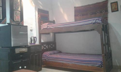 Llit o llits en una habitació de Wara Wara