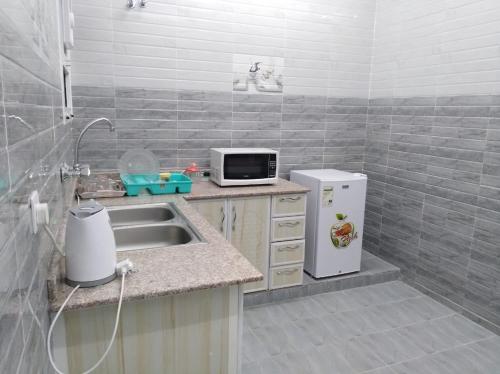 Virtuvė arba virtuvėlė apgyvendinimo įstaigoje Dar ALHamra Inn
