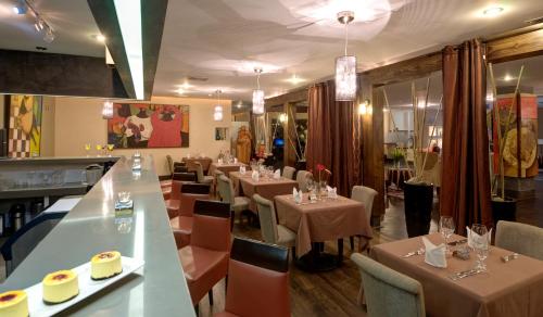 Un restaurante o sitio para comer en Studio Hotel Boutique