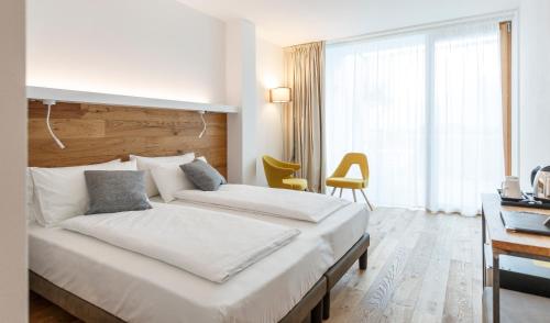เตียงในห้องที่ ALEA - Garda Lake Suite