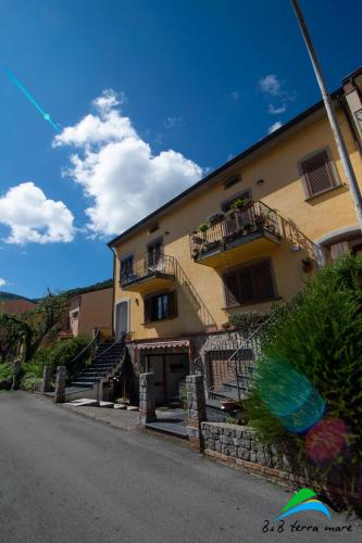 a large building with stairs and balconies on it at B&B Terra Mare in Trecchina