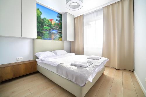 Postel nebo postele na pokoji v ubytování Calamo Park, Apartamenty z klimatyzacją