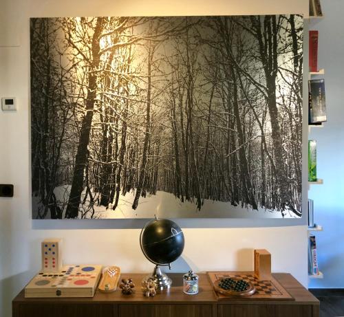 a painting of trees hanging on a wall at Hotel Eigón in Posada de Valdeón
