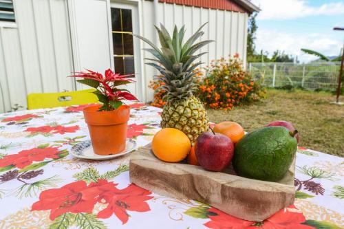 a pile of fruit sitting on top of a table at Le Chalet à Joel in Cilaos