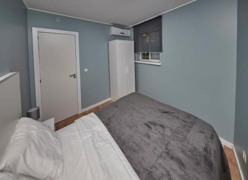 a bedroom with a large bed in a room at Quinta da Villa in Cascais