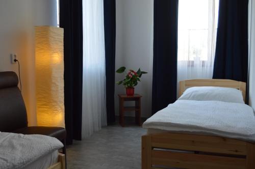 Postel nebo postele na pokoji v ubytování Vila Lípa
