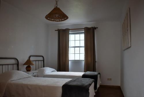 Ένα ή περισσότερα κρεβάτια σε δωμάτιο στο Casa das Ondas