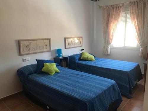 En eller flere senge i et værelse på El Bosque, tu entrada a la Sierra Gaditana.