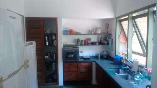 Majoituspaikan Casa em Toque Toque Pequeno keittiö tai keittotila