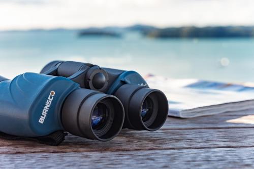 a pair of binoculars sitting on top of a table at Marina Cove Bay of Islands in Opua