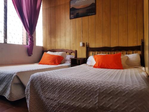 Säng eller sängar i ett rum på Hotel Metropolitano