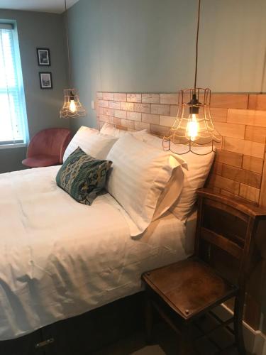 Ένα ή περισσότερα κρεβάτια σε δωμάτιο στο Rooms at Martha Jones