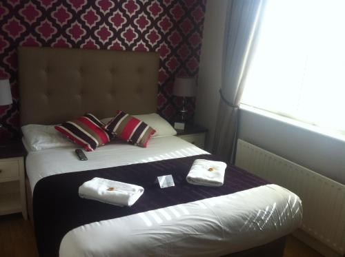 Postel nebo postele na pokoji v ubytování Abbey Lodge B&B