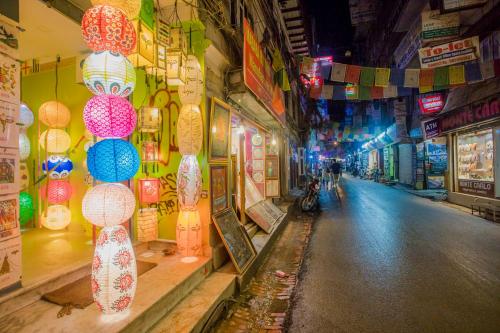 an alley with lanterns on the side of a street at Shiva Shankar Hotel in Pashupatināth