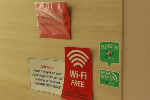 a door with signs on the wall of a room at Khongor Guest house & Tours in Ulaanbaatar