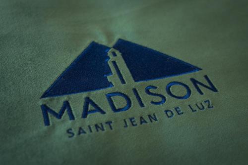 a close up of a madison sant start team logo at MADISON Saint Jean de Luz - Handwritten Collection in Saint-Jean-de-Luz