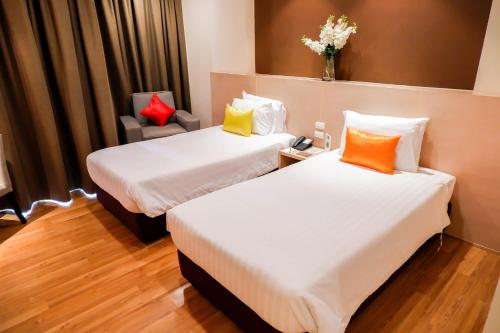 מיטה או מיטות בחדר ב-Park Village Rama II