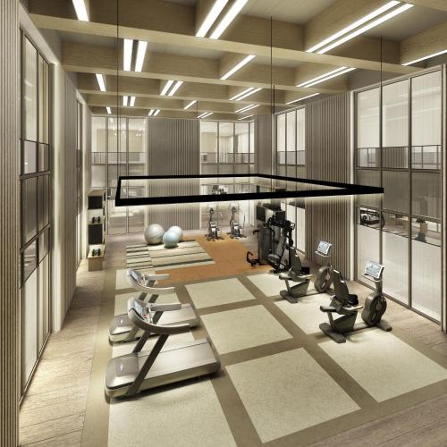 a gym with treadmills and exercise equipment in a room at Mumian Shenzhen Luohu JDV by Hyatt in Shenzhen
