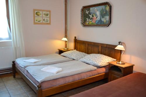 A bed or beds in a room at Blažkův Statek