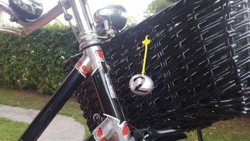 a bike with a helmet on the front of it at Villetta Cinquale Versilia in Cinquale
