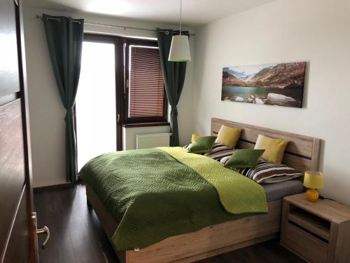 Posteľ alebo postele v izbe v ubytovaní Apartmán pod Štítom