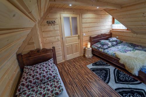 Cama ou camas em um quarto em Domek Regionalny Dan Pio